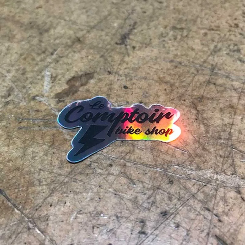 Sticker LECOMPTOIRBIKESHOP Holographic Small 2 Sticker LECOMPTOIRBIKESHOP Holographic Small – Image 2